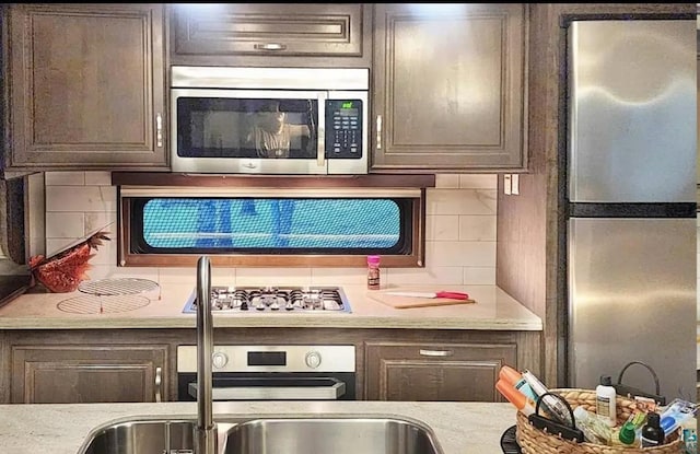 1437 Severson Rd, Summit Twp, WI 54836 - kitchen featuring stainless steel appliances and backsplash