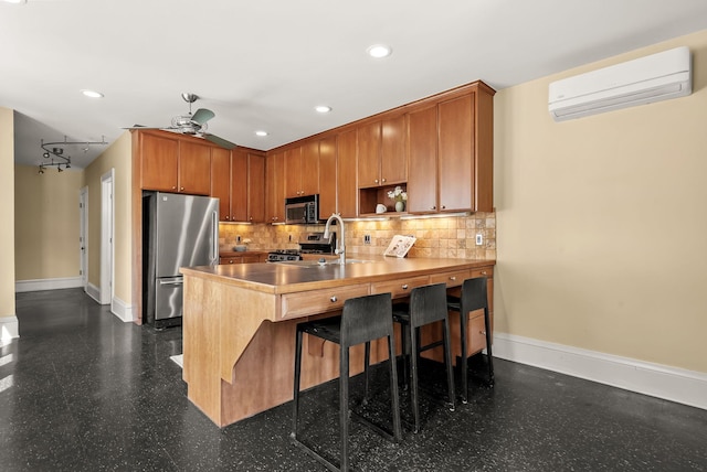 4705 Lyndale Ave S, Minneapolis, MN 55419 - kitchen featuring appliances with stainless steel finishes, a wall unit AC, a peninsula, a ceiling fan, and recessed lighting