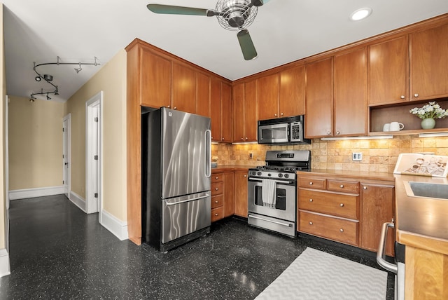 4705 Lyndale Ave S, Minneapolis, MN 55419 - kitchen with stainless steel appliances, a ceiling fan, baseboards, and tasteful backsplash