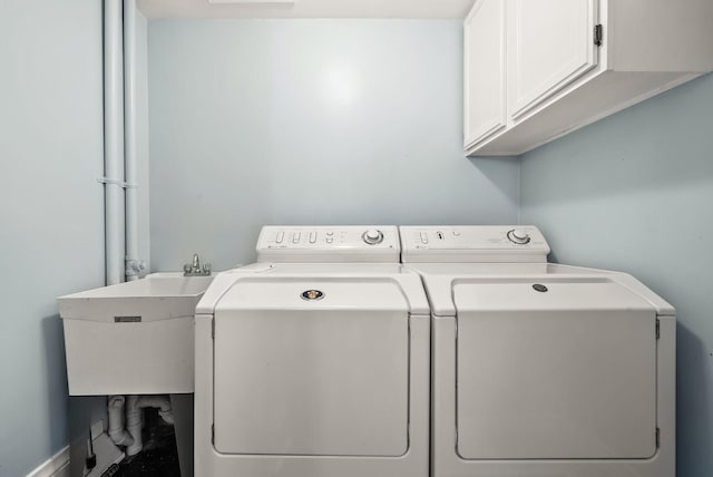 4705 Lyndale Ave S, Minneapolis, MN 55419 - laundry room featuring washing machine and clothes dryer and cabinet space