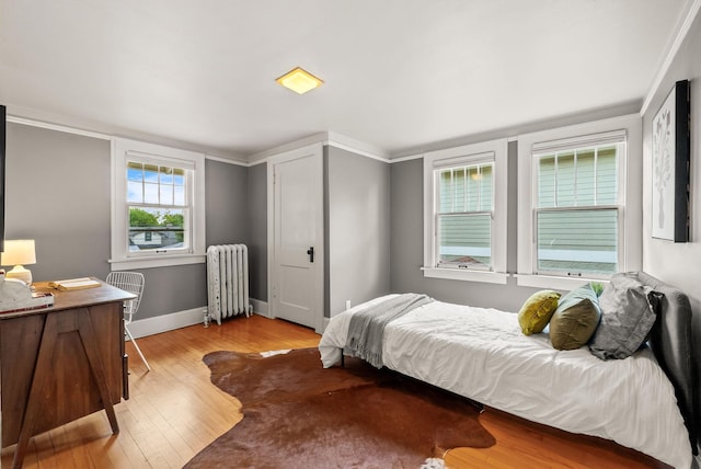 4705 Lyndale Ave S, Minneapolis, MN 55419 - bedroom with radiator, wood finished floors, baseboards, and a desk