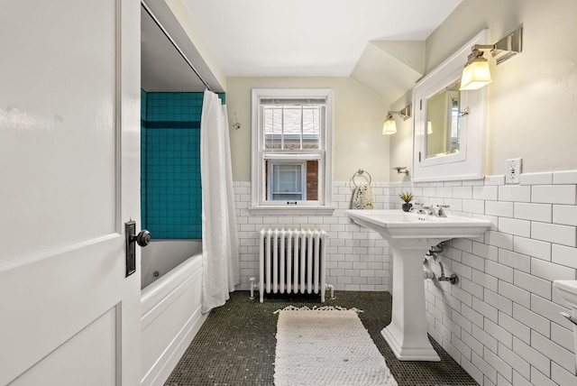 4705 Lyndale Ave S, Minneapolis, MN 55419 - full bathroom featuring radiator, tile walls, shower / bathtub combination with curtain, wainscoting, and tile patterned flooring