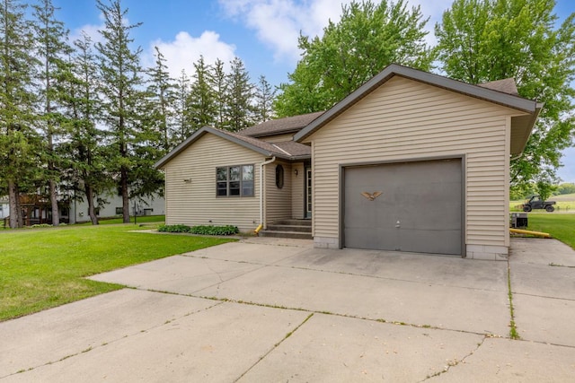 425 Franklin St, Morristown, MN 55052 - ranch-style house with driveway, a garage, and a front lawn
