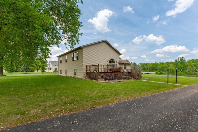 425 Franklin St, Morristown, MN 55052 - view of property exterior featuring a deck and a yard
