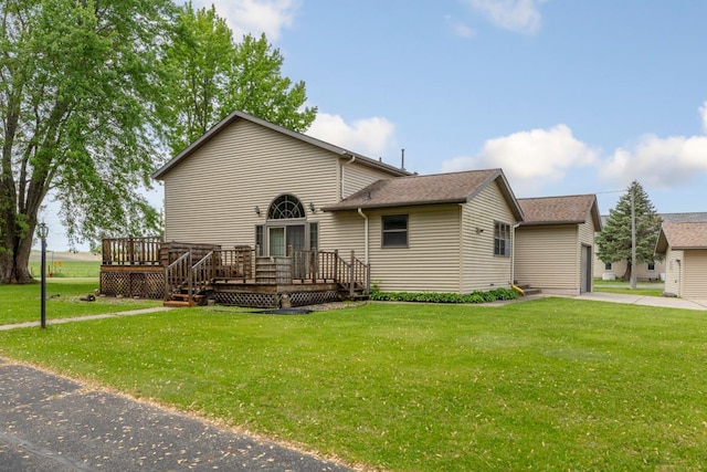 425 Franklin St, Morristown, MN 55052 - view of front of home with a deck, a front lawn, and a garage