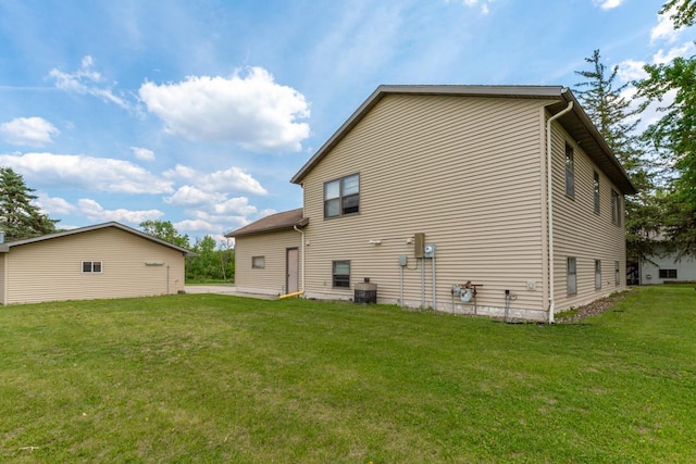 425 Franklin St, Morristown, MN 55052 - rear view of property featuring a yard and central air condition unit