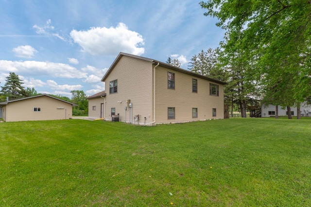425 Franklin St, Morristown, MN 55052 - back of property featuring a lawn and central AC unit
