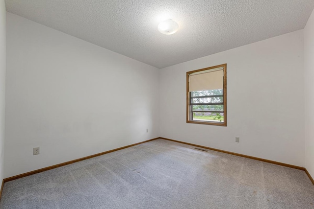 425 Franklin St, Morristown, MN 55052 - carpeted empty room featuring baseboards and a textured ceiling
