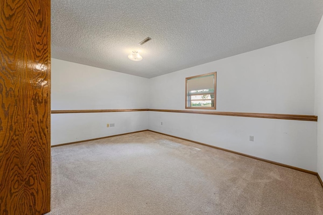 425 Franklin St, Morristown, MN 55052 - carpeted spare room with baseboards and a textured ceiling