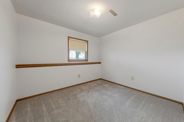 425 Franklin St, Morristown, MN 55052 - carpeted empty room with baseboards and a textured ceiling