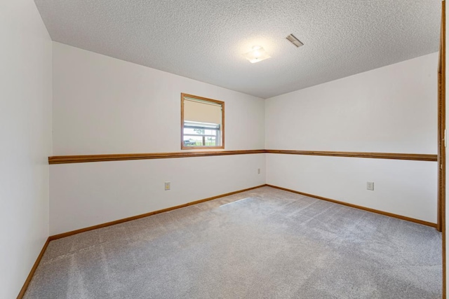 425 Franklin St, Morristown, MN 55052 - carpeted spare room with baseboards and a textured ceiling