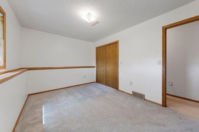 425 Franklin St, Morristown, MN 55052 - spare room with carpet, a textured ceiling, and baseboards