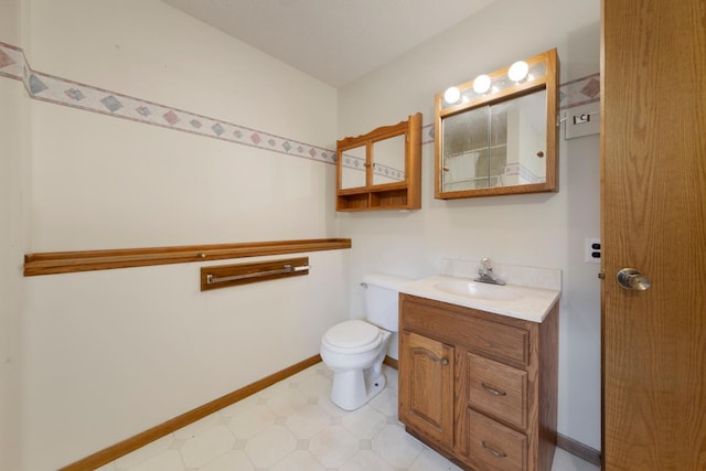 425 Franklin St, Morristown, MN 55052 - bathroom featuring vanity, toilet, and baseboards