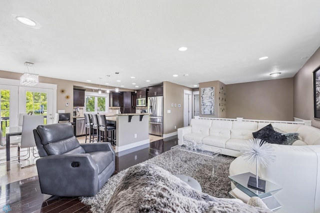 18117 Cherry Creek Ln, Erie Twp, MN 56501 - living area with dark wood-style flooring, recessed lighting, and baseboards