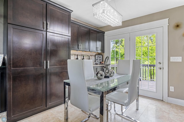 18117 Cherry Creek Ln, Erie Twp, MN 56501 - dining room featuring a chandelier and baseboards