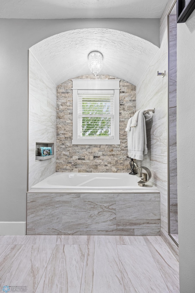 18117 Cherry Creek Ln, Erie Twp, MN 56501 - full bathroom featuring a bath and a chandelier