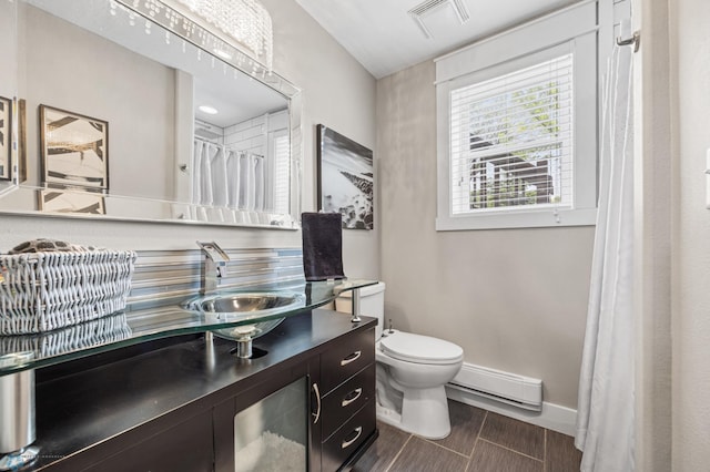 18117 Cherry Creek Ln, Erie Twp, MN 56501 - full bath featuring a baseboard radiator, vanity, baseboards, toilet, and a shower with curtain