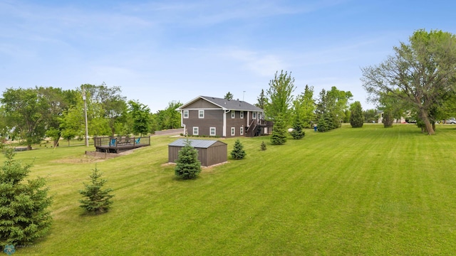 18117 Cherry Creek Ln, Erie Twp, MN 56501 - view of grassy yard featuring an outbuilding and a wooden deck