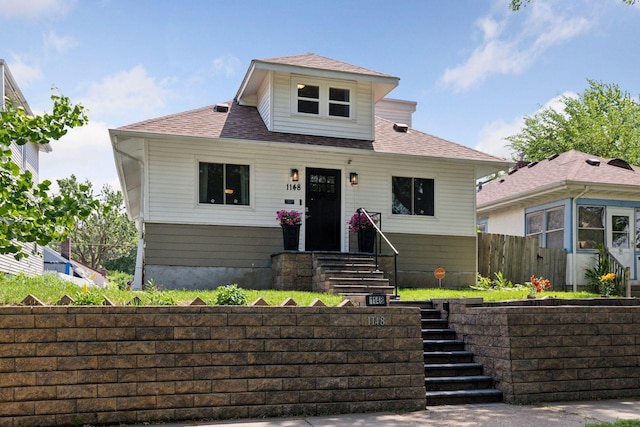 1148 Geranium Ave E, Saint Paul, MN 55106 - bungalow-style house featuring a shingled roof and stairway
