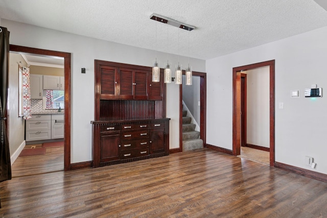 1148 Geranium Ave E, Saint Paul, MN 55106 - living room featuring dark wood finished floors, stairway, a textured ceiling, and baseboards