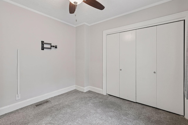 1148 Geranium Ave E, Saint Paul, MN 55106 - unfurnished bedroom with ornamental molding, baseboards, carpet floors, a closet, and ceiling fan