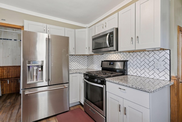 1148 Geranium Ave E, Saint Paul, MN 55106 - kitchen featuring appliances with stainless steel finishes, tasteful backsplash, white cabinetry, light stone countertops, and ornamental molding