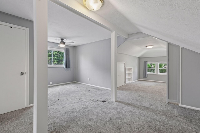 1148 Geranium Ave E, Saint Paul, MN 55106 - bonus room with carpet flooring, a textured ceiling, vaulted ceiling, ceiling fan, and baseboards