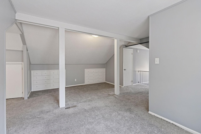 1148 Geranium Ave E, Saint Paul, MN 55106 - bonus room featuring carpet floors, vaulted ceiling, and baseboards