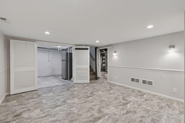 1148 Geranium Ave E, Saint Paul, MN 55106 - finished below grade area with stairway, recessed lighting, freestanding refrigerator, and baseboards