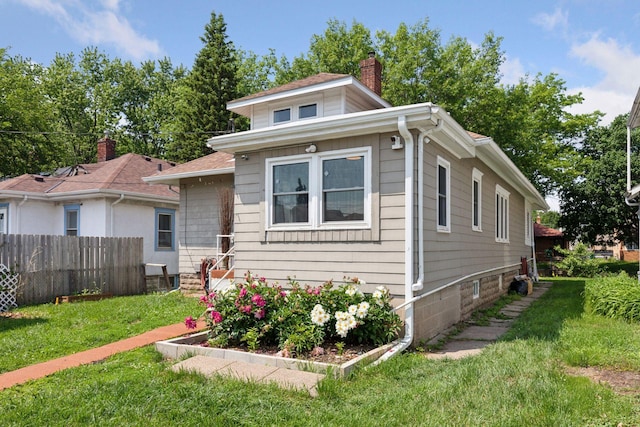 1148 Geranium Ave E, Saint Paul, MN 55106 - bungalow-style house featuring a chimney
