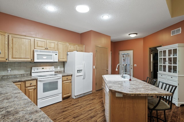 11645 Alpine Dr, Monticello, MN 55362 - kitchen with white appliances, a sink, dark wood finished floors, a textured ceiling, and light countertops