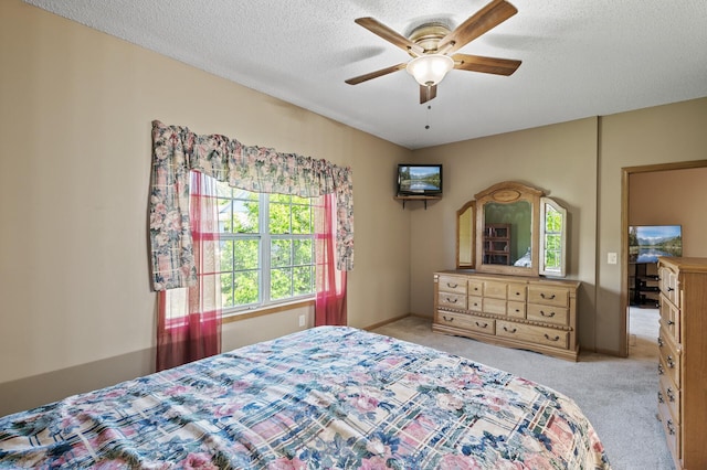 11645 Alpine Dr, Monticello, MN 55362 - bedroom with light colored carpet, a textured ceiling, and a ceiling fan