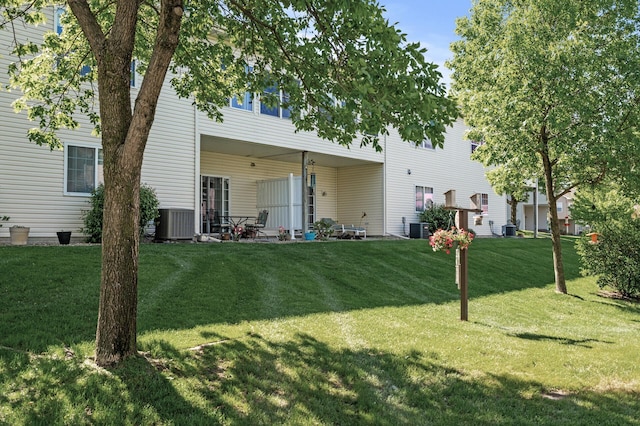 11645 Alpine Dr, Monticello, MN 55362 - back of house with a yard, central AC, and a patio area