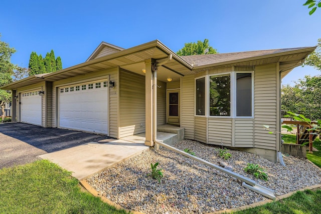 1110 Lia Ct, Northfield, MN 55057 - ranch-style house with a garage, asphalt driveway, and a shingled roof