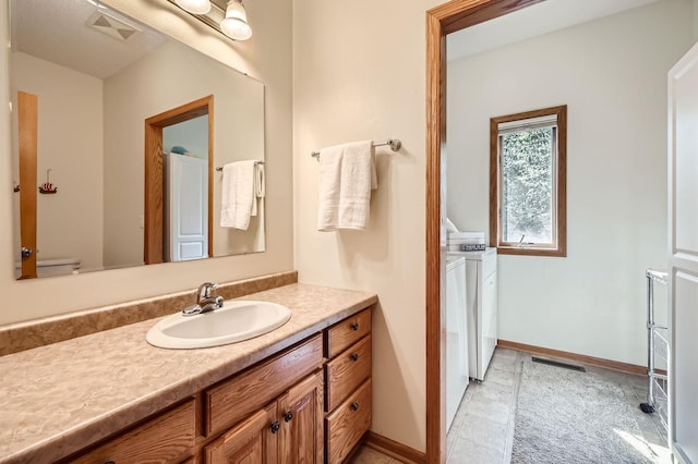 1110 Lia Ct, Northfield, MN 55057 - bathroom featuring washer and clothes dryer and vanity