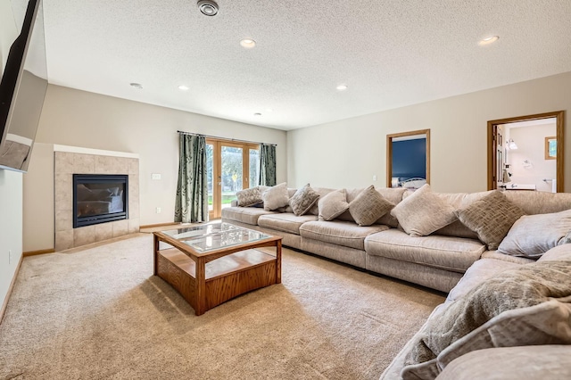 1110 Lia Ct, Northfield, MN 55057 - living room with carpet flooring, a textured ceiling, recessed lighting, and a tiled fireplace