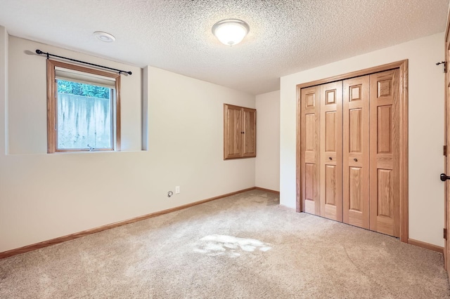 1110 Lia Ct, Northfield, MN 55057 - unfurnished bedroom featuring light carpet, a closet, and a textured ceiling