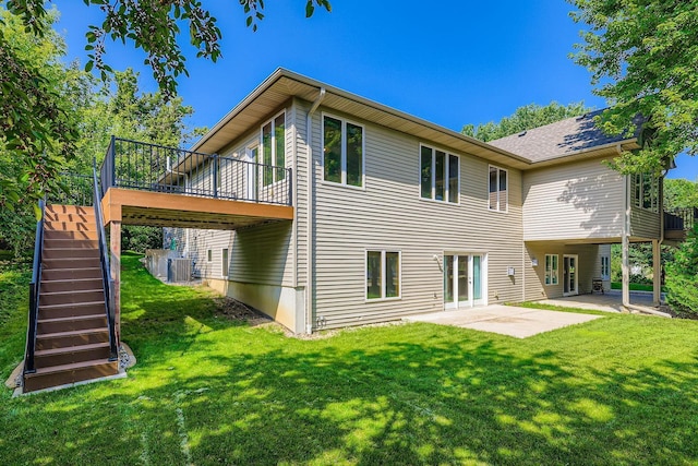 1110 Lia Ct, Northfield, MN 55057 - rear view of property with a patio, a yard, stairs, and a deck