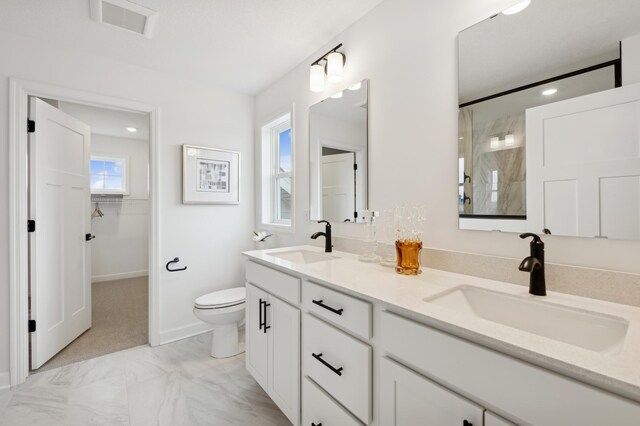 4637 Obsidian Way, Victoria, MN 55386 - full bath with double vanity, a shower, marble look tiles, a spacious closet, and recessed lighting