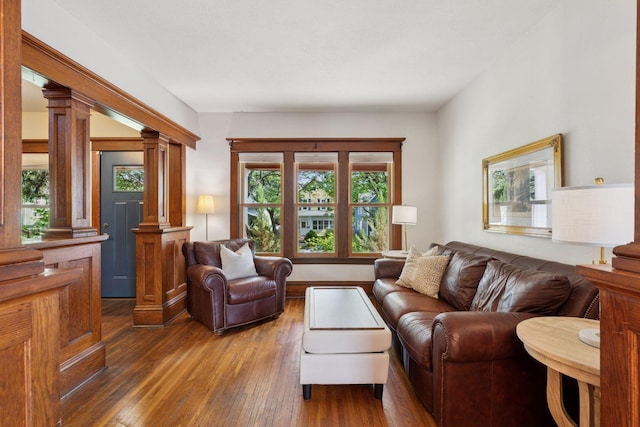 896 Carroll Ave, Saint Paul, MN 55104 - living area with ornate columns and hardwood / wood-style flooring