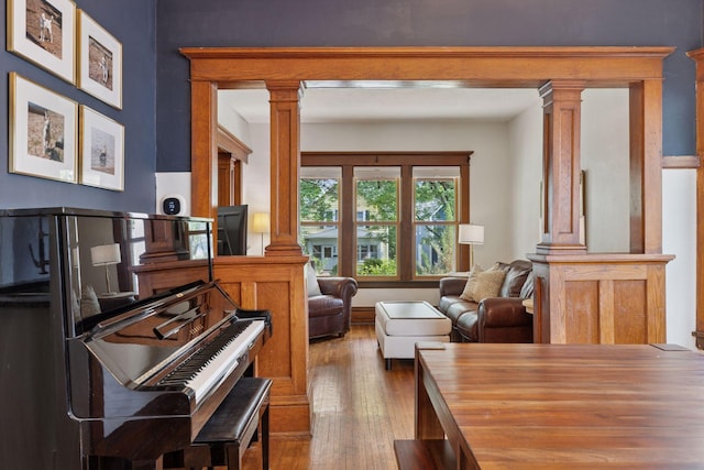 896 Carroll Ave, Saint Paul, MN 55104 - sitting room with decorative columns and wood-type flooring