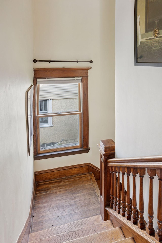 896 Carroll Ave, Saint Paul, MN 55104 - stairs featuring baseboards and wood finished floors