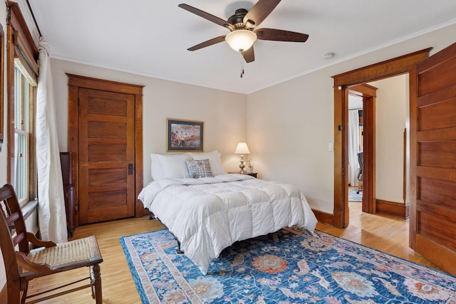 896 Carroll Ave, Saint Paul, MN 55104 - bedroom featuring light wood-style floors, crown molding, and a ceiling fan