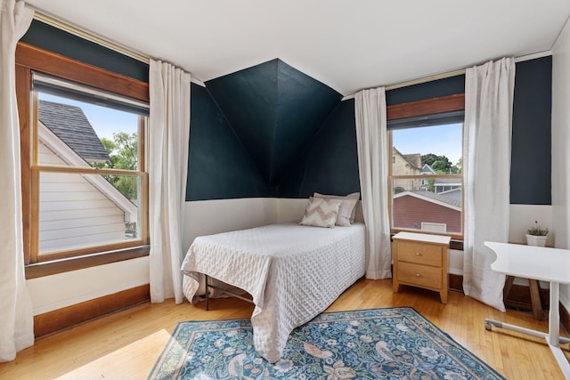 896 Carroll Ave, Saint Paul, MN 55104 - bedroom with lofted ceiling and light wood-style floors