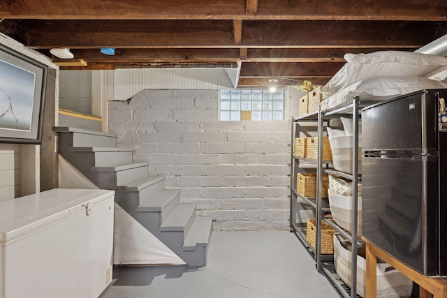 896 Carroll Ave, Saint Paul, MN 55104 - basement with freestanding refrigerator and stairs