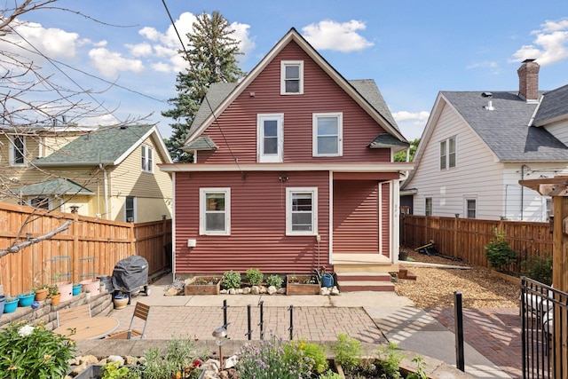 896 Carroll Ave, Saint Paul, MN 55104 - back of property featuring a patio, a fenced backyard, and entry steps