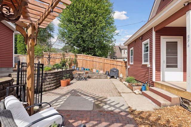896 Carroll Ave, Saint Paul, MN 55104 - fenced backyard featuring a patio area, a pergola, and outdoor dining area
