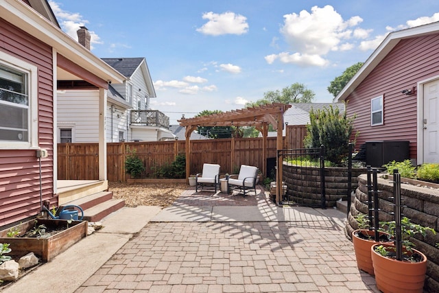 896 Carroll Ave, Saint Paul, MN 55104 - fenced backyard with a patio area, a pergola, and entry steps