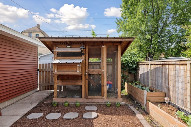 896 Carroll Ave, Saint Paul, MN 55104 - view of poultry coop featuring a vegetable garden