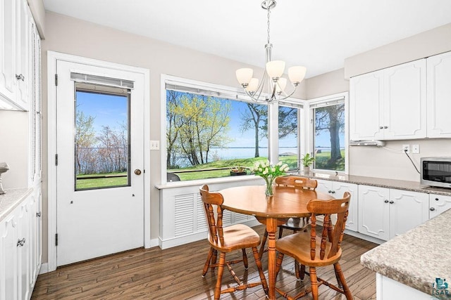 2900 London Rd, Duluth, MN 55804 - dining space featuring a chandelier and wood finished floors
